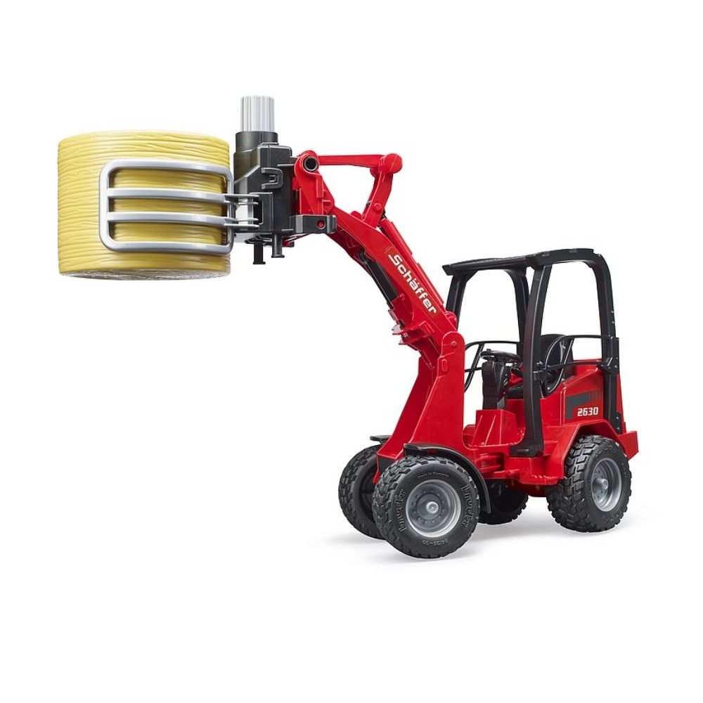 Carregadora Schäffer 2630 com acessórios e fardo de feno