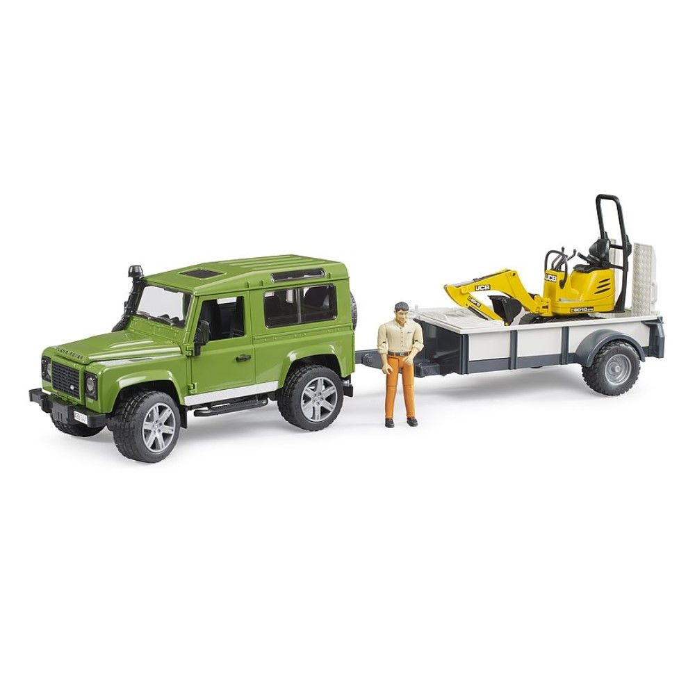 Land Rover Defender com reboque, microescavadora JCB e 1 figura
