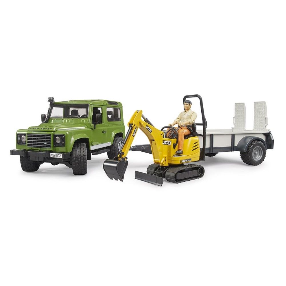 Land Rover Defender com reboque, microescavadora JCB e 1 figura